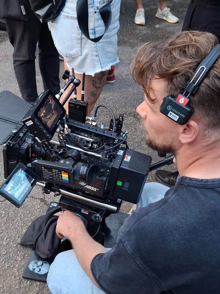 Jacek Snochowski operating camera on set